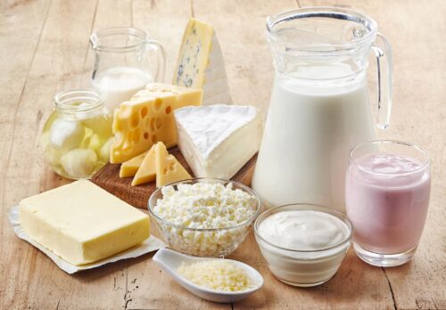Dairy Consumption Increases Risk of Cancer Various fresh dairy products on wooden background