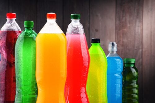 Sweetened Drinks Linked to Atrial Fibrillation Risk Plastic bottles of assorted carbonated soft drinks in variety of colors
